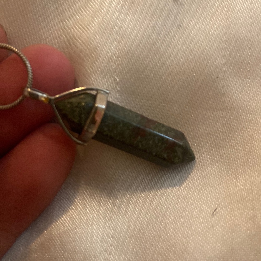 Dragon blood crystal pendant on silver chain needs to be polished